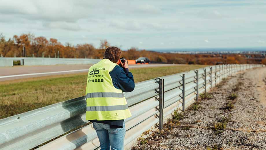 Dennis Noten standing behind the barrier at the race track during a GP Days Open Pitlane Track Day